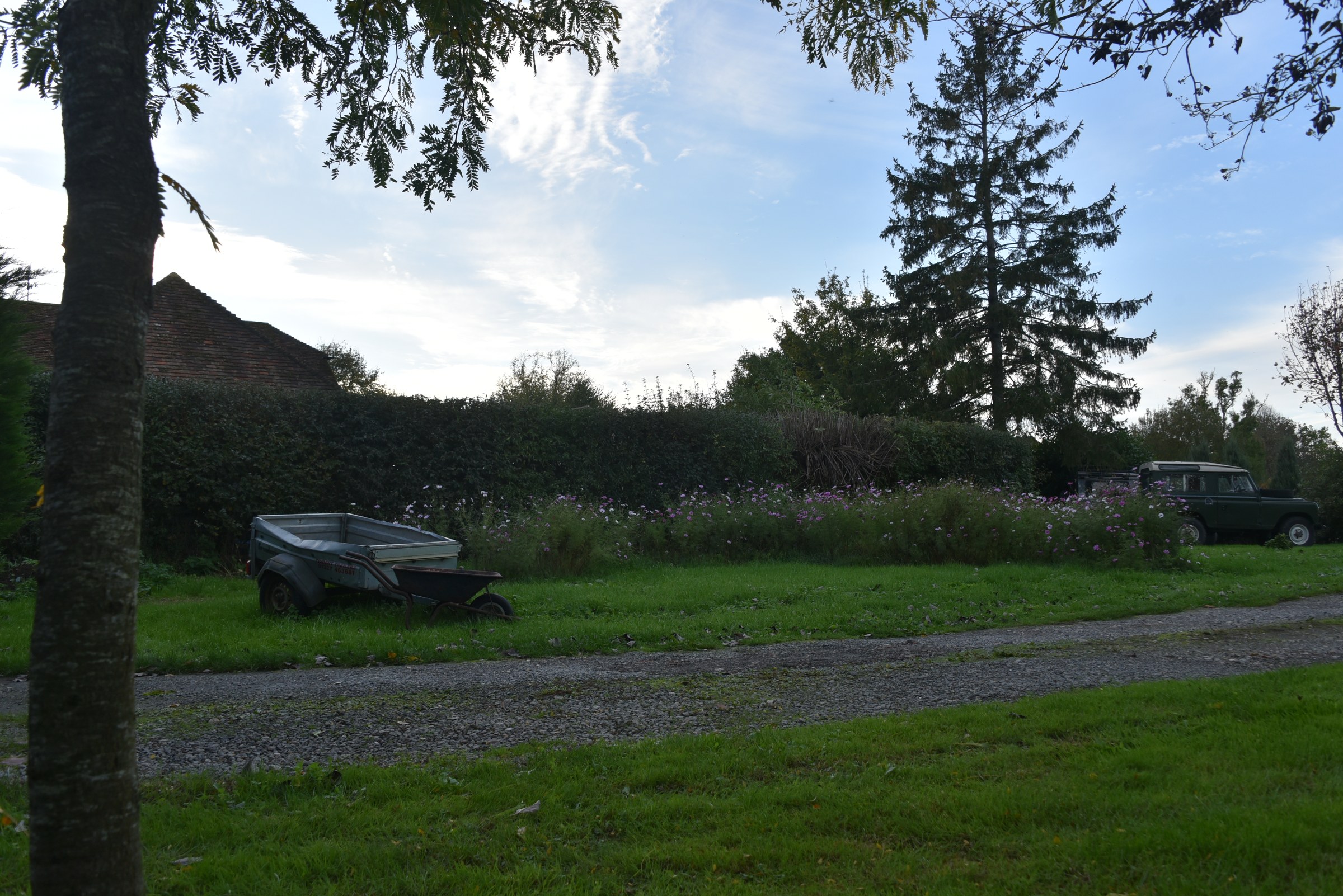 The original site photograph across the lawn, before the annex was added